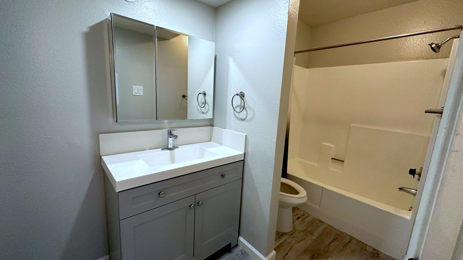 Bathroom with vanity and tub