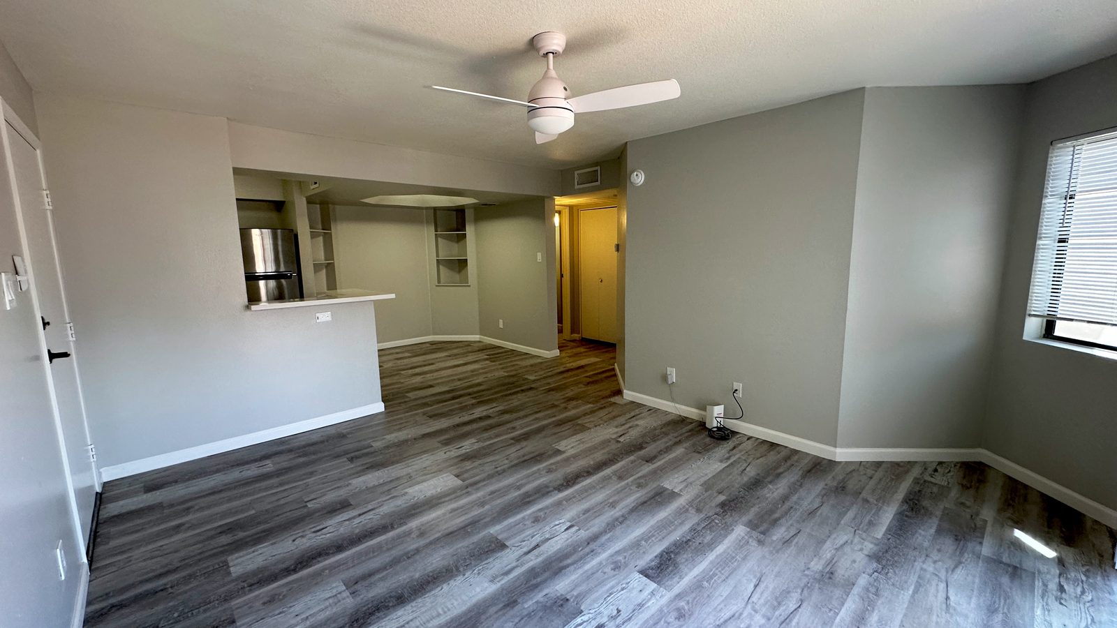 Living room, with the kitchen peninsula beyond