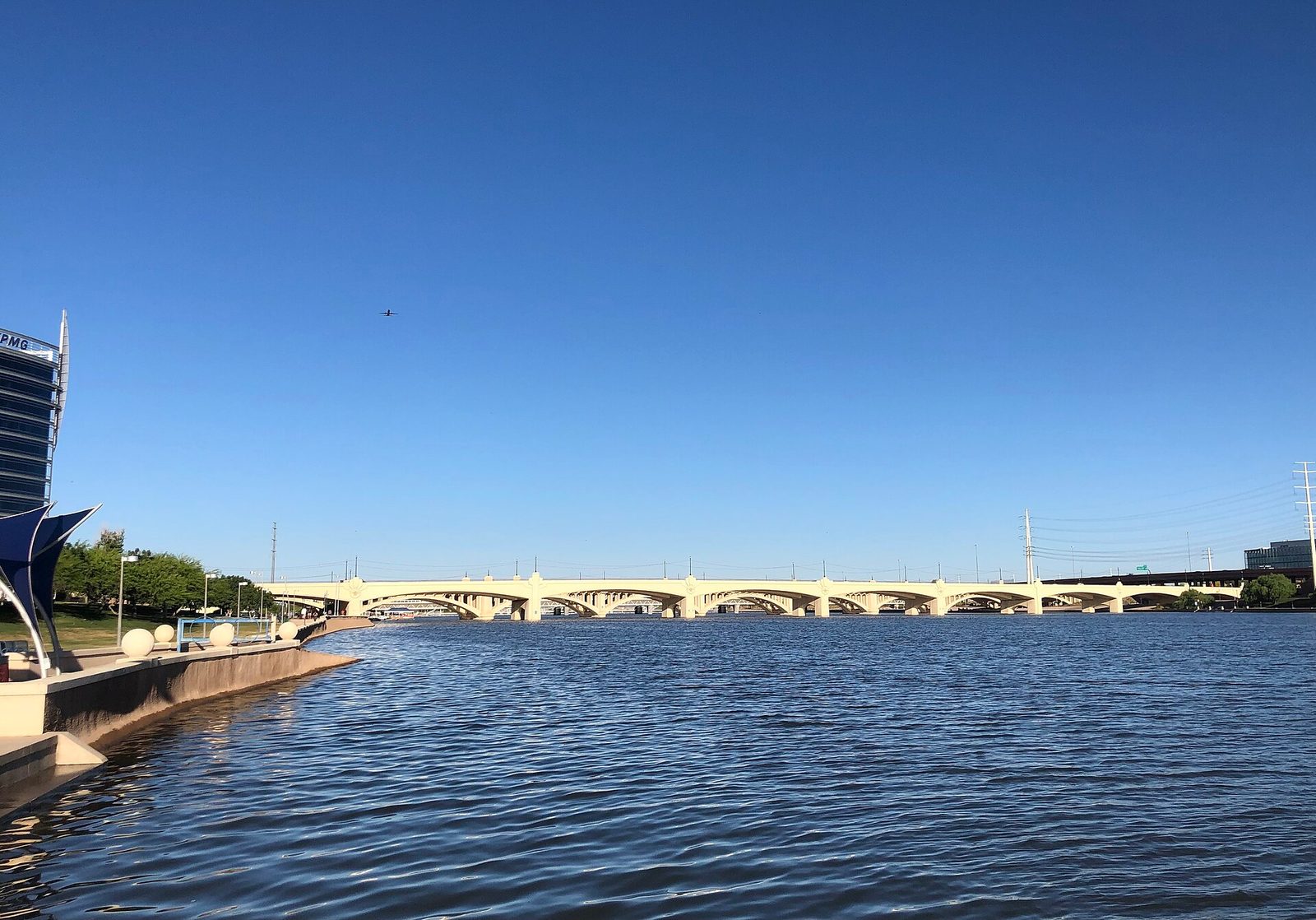 Tempe Town Lake and the Mill Avenue bridges under a blue sky
